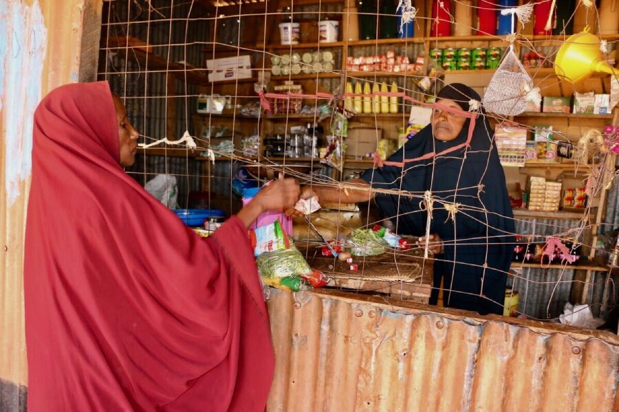 In Kenya, WFP-cash transfers have helped women like this one buy food during the country's devastating drought. Photo: WFP/Martin Karimi